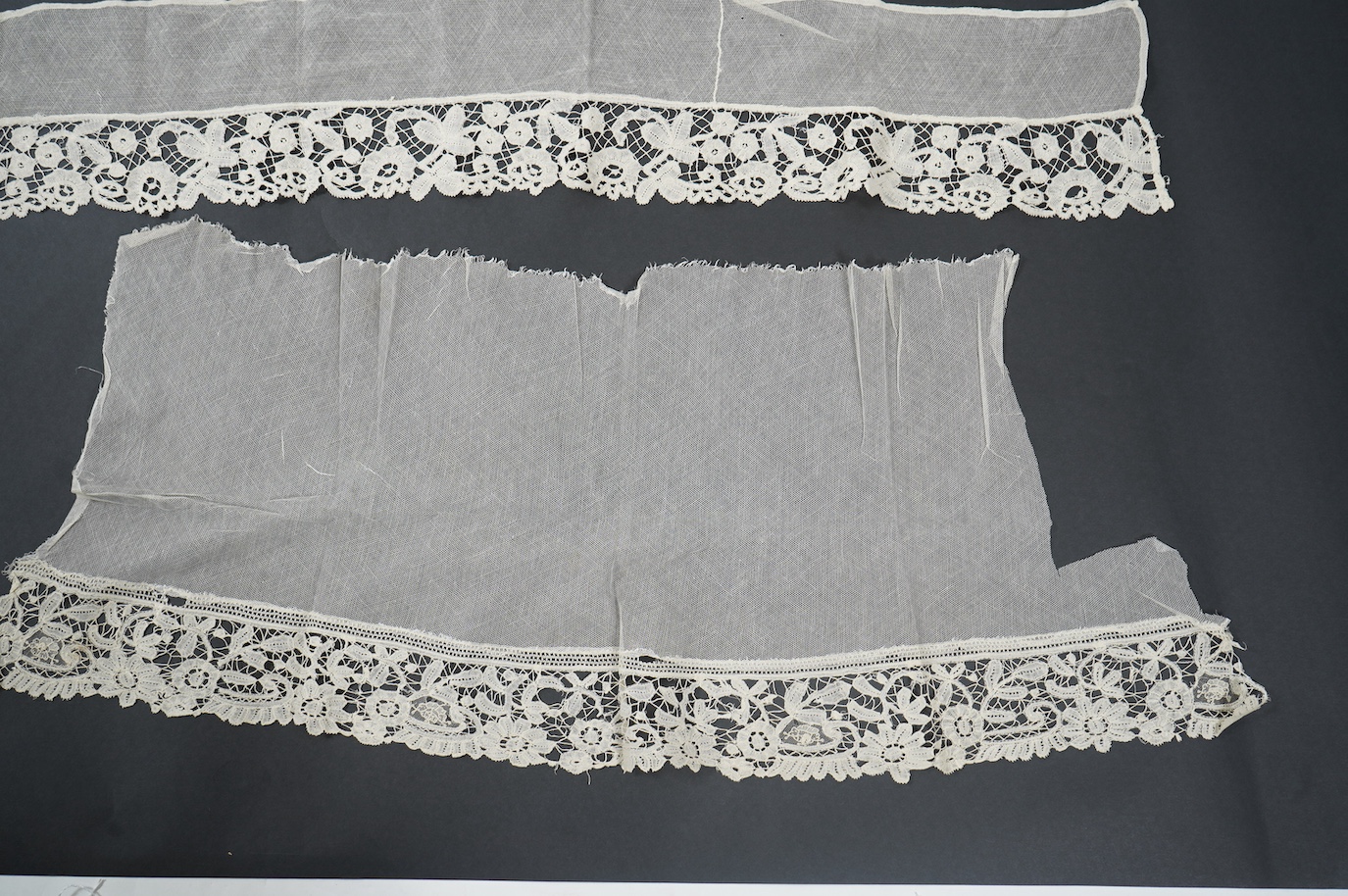 A late 19th century Brussels bobbin lace on net section of a wedding veil, Brussels bobbin lace collar, a point de gaz lace motif and two lengths of later bobbin lace trimming possibly Honiton with needle lace insertions